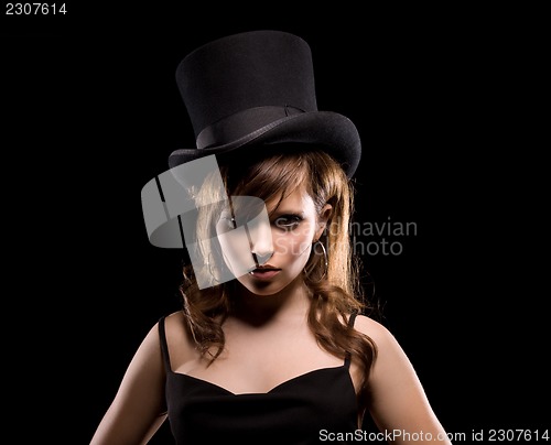 Image of woman in black dress and top hat