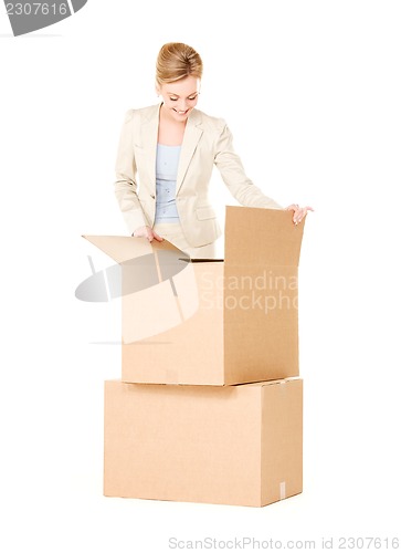 Image of businesswoman with boxes