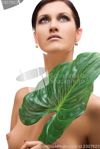 Image of woman with green leaf