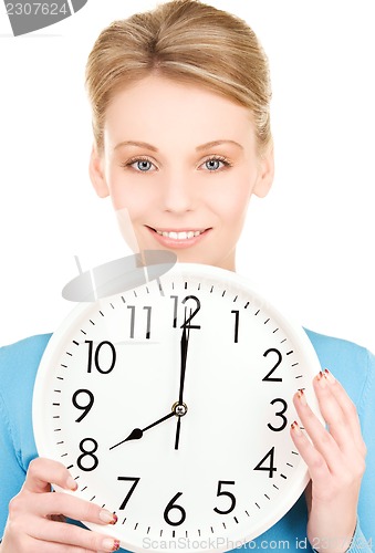 Image of woman holding big clock