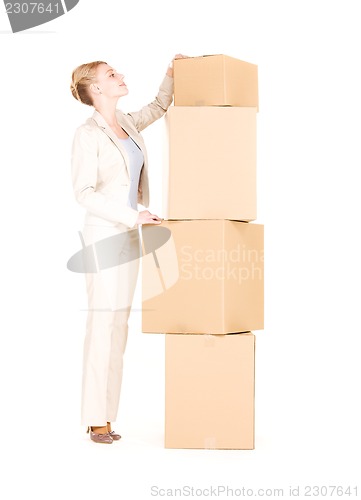 Image of businesswoman with boxes