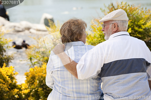 Image of Happy Senior Couple on Bench in The Park