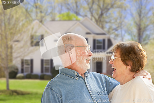 Image of Happy Senior Couple in Front Yard of House