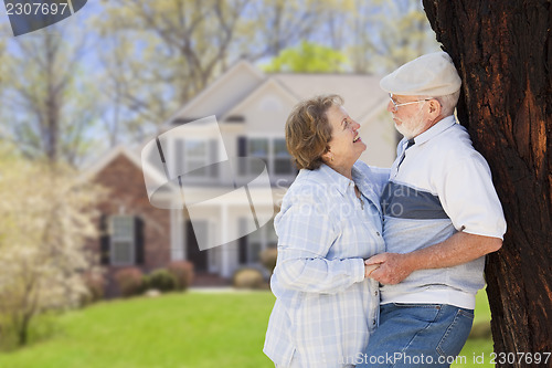 Image of Happy Senior Couple in Front Yard of House