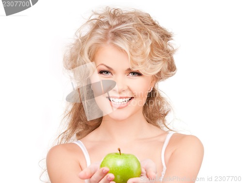 Image of young beautiful woman with green apple