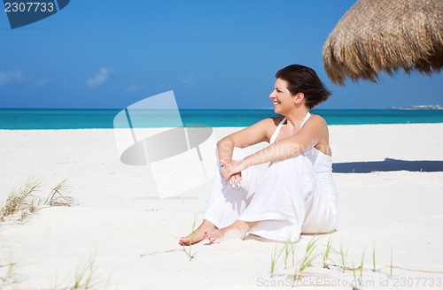 Image of happy woman on the beach