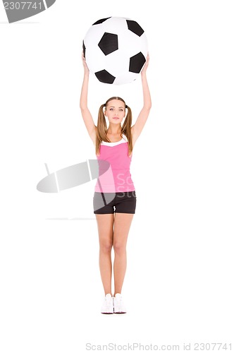 Image of lovely woman with big soccer ball