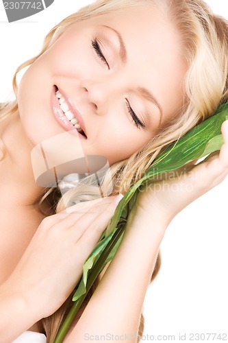 Image of woman with green leaf