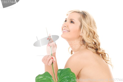 Image of woman with green leaf