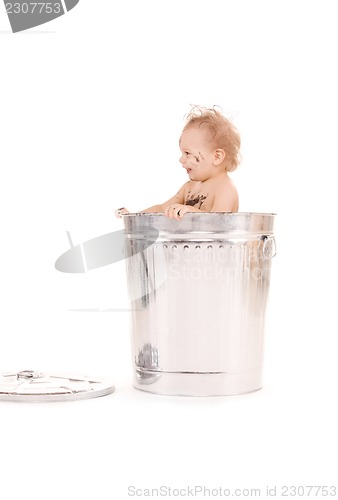 Image of baby in trash can