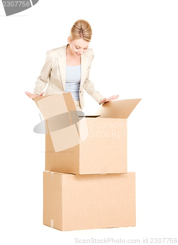 Image of businesswoman with boxes