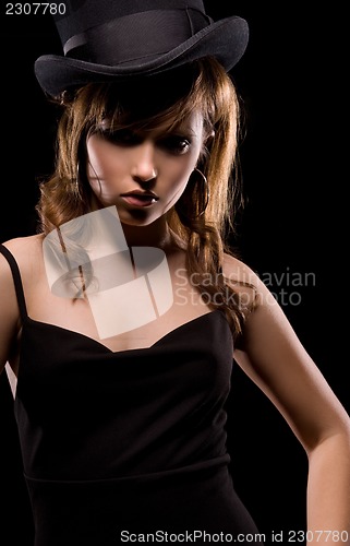 Image of woman in black dress and top hat