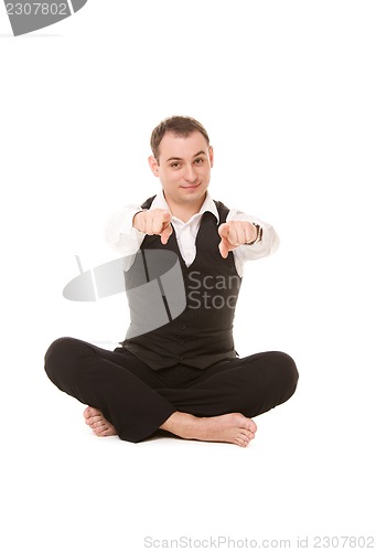 Image of businessman sitting in lotus pose