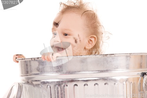 Image of baby in trash can