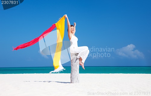 Image of happy woman on the beach