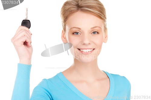 Image of happy woman with car key
