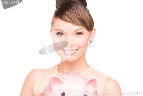 Image of lovely woman with piggy bank