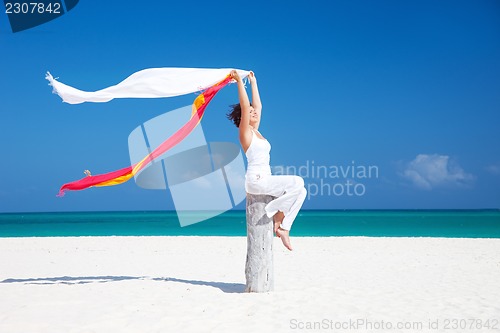 Image of happy woman on the beach