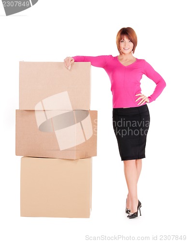 Image of businesswoman with boxes