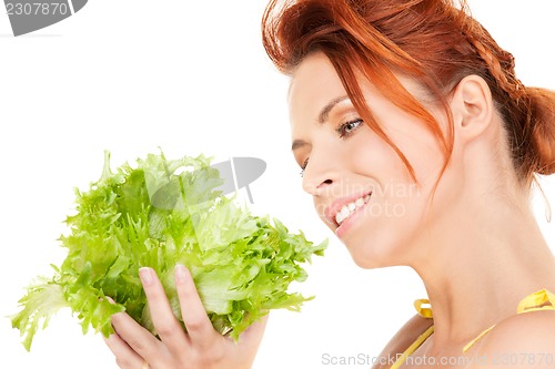 Image of happy woman with lettuce