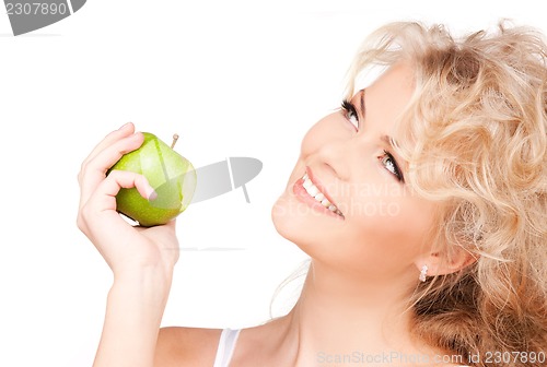 Image of young beautiful woman with green apple