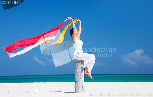 Image of happy woman on the beach