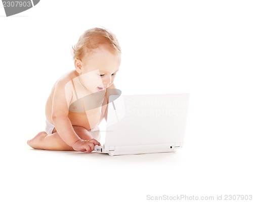 Image of baby boy with laptop computer