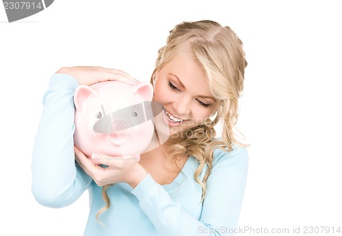 Image of lovely woman with piggy bank