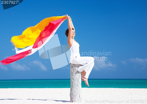 Image of happy woman on the beach