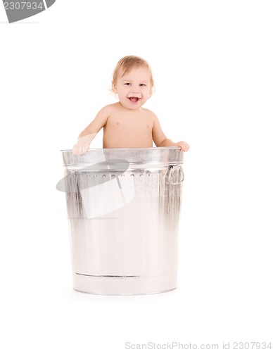 Image of baby in trash can