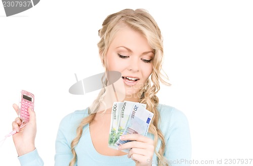 Image of happy woman with calculator and money