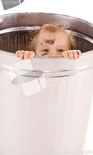 Image of baby in trash can