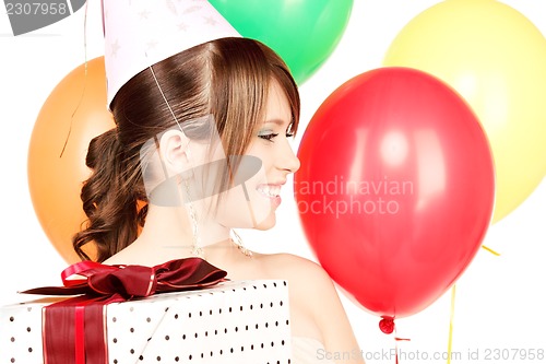 Image of party girl with balloons and gift box