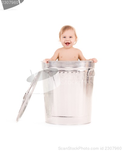 Image of baby in trash can