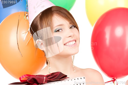 Image of party girl with balloons and gift box