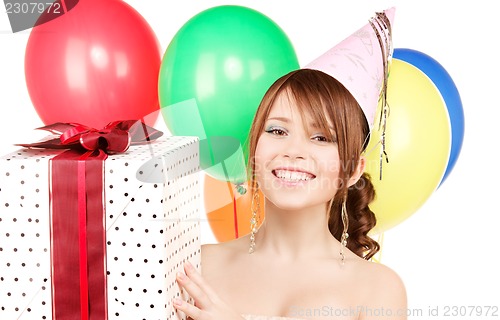Image of party girl with balloons and gift box