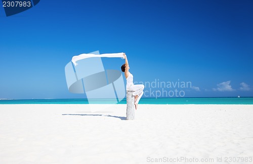 Image of happy woman on the beach