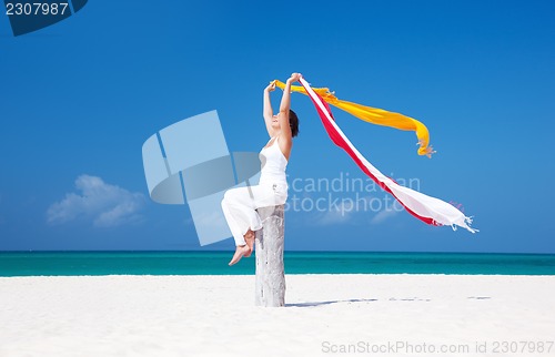 Image of happy woman on the beach