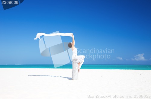 Image of happy woman on the beach