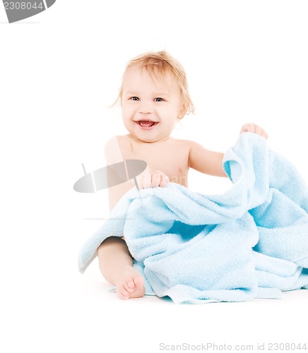 Image of baby with blue towel