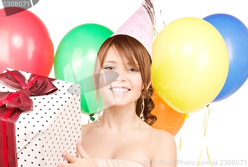 Image of party girl with balloons and gift box