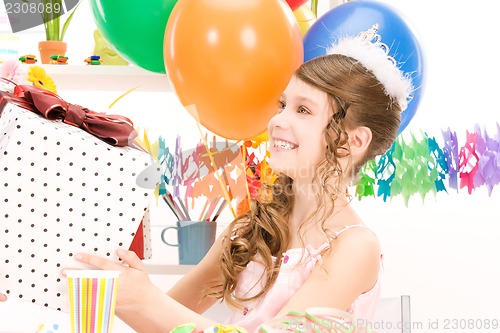 Image of party girl with balloons and gift box