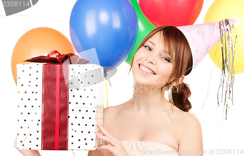 Image of party girl with balloons and gift box