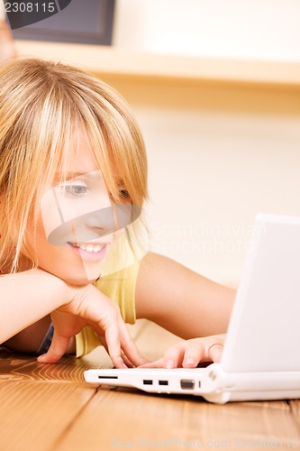 Image of teenage girl with laptop computer