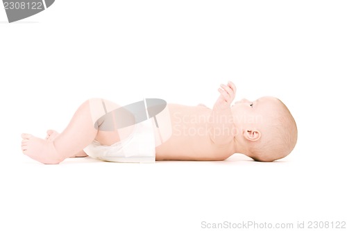 Image of laying baby boy in diaper