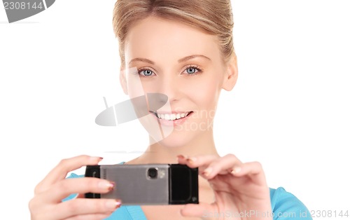 Image of happy woman using phone camera