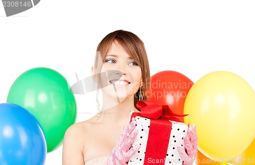 Image of party girl with balloons and gift box