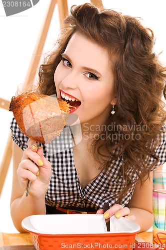 Image of young attractive woman in the kitchen