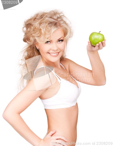 Image of young beautiful woman with green apple