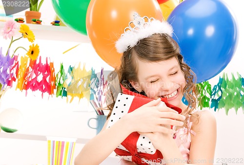 Image of party girl with balloons and gift box